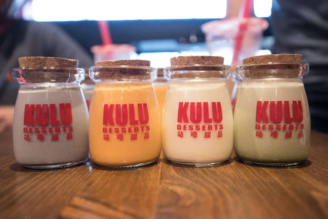 Sesame, Thai tea, Durian, and Matcha milk pudding jars at Kulu<br/>